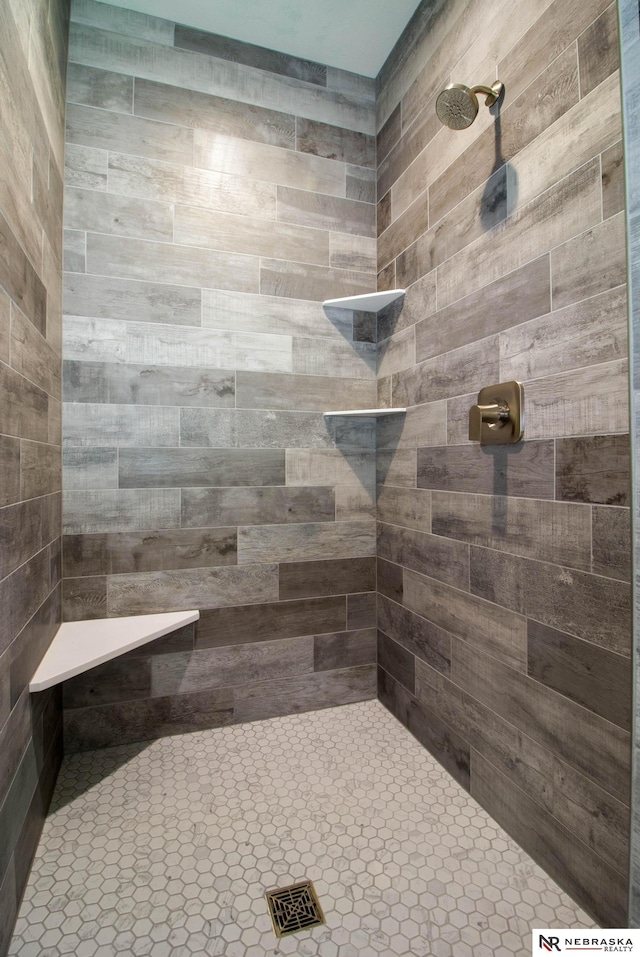 bathroom with a tile shower