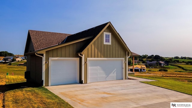 exterior space with a garage and a front yard