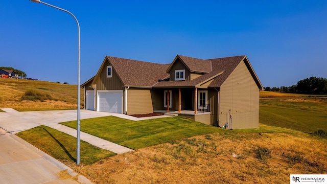 view of front facade featuring a front yard and a garage