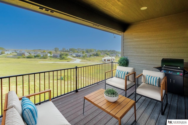 deck featuring a yard and area for grilling