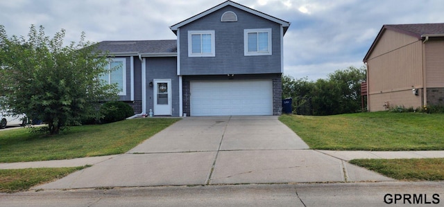 view of front of house with a garage and a front yard