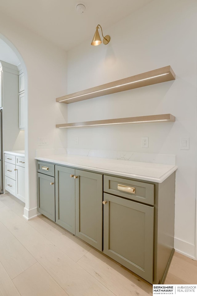 bar with arched walkways and baseboards