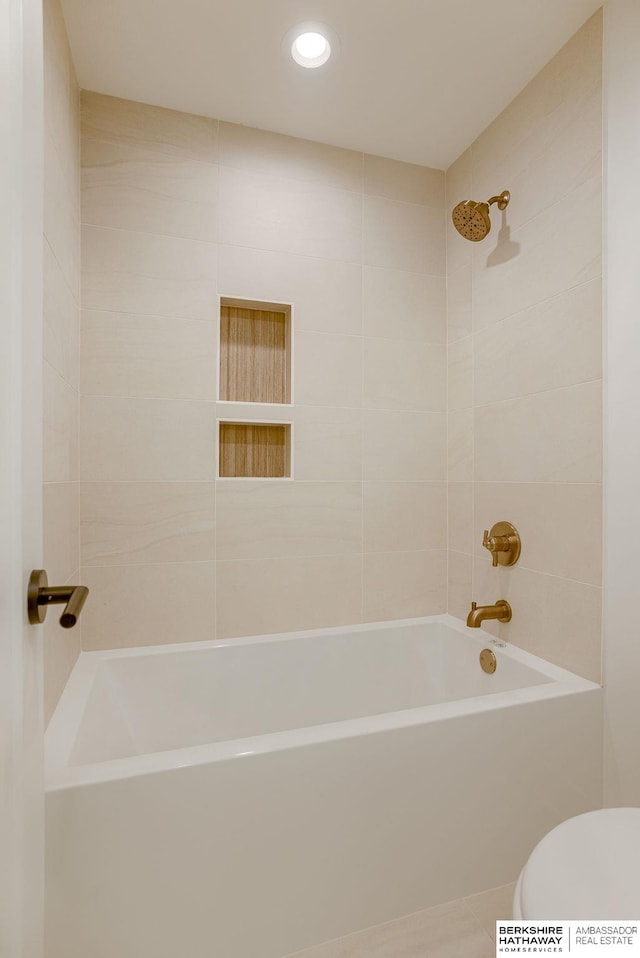 bathroom with shower / tub combination and toilet