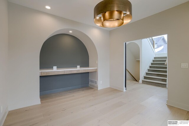 interior space with light wood-style flooring, stairway, visible vents, baseboards, and recessed lighting