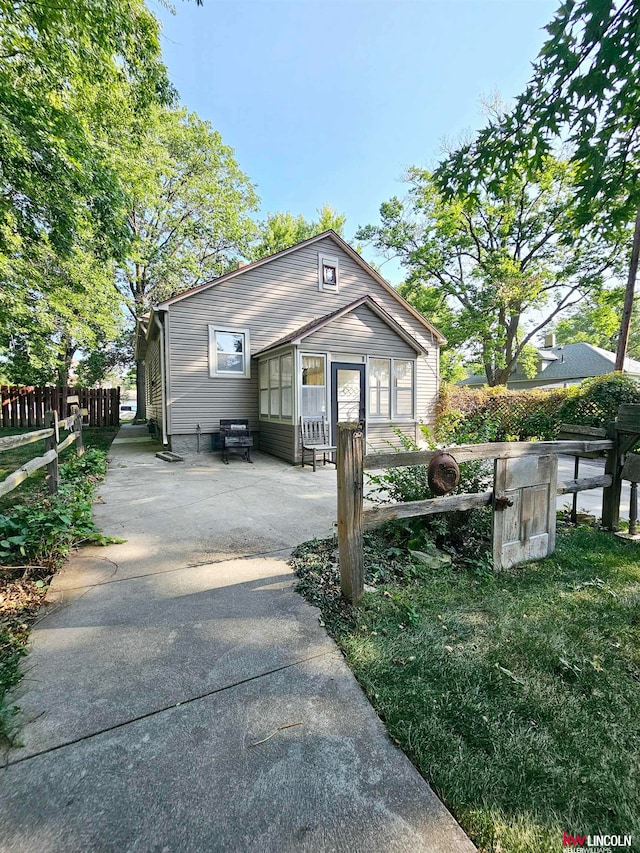 view of property exterior with a yard