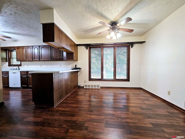 kitchen featuring a textured ceiling, dark wood-type flooring, and ceiling fan