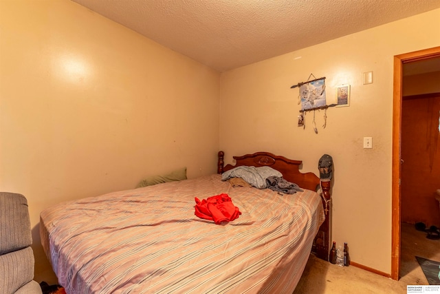 carpeted bedroom with a textured ceiling