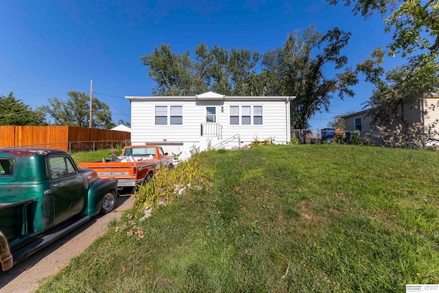 rear view of house with a lawn