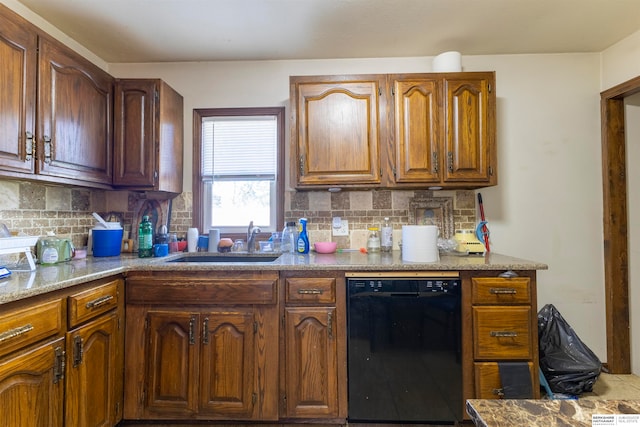 kitchen with black dishwasher, sink, and tasteful backsplash