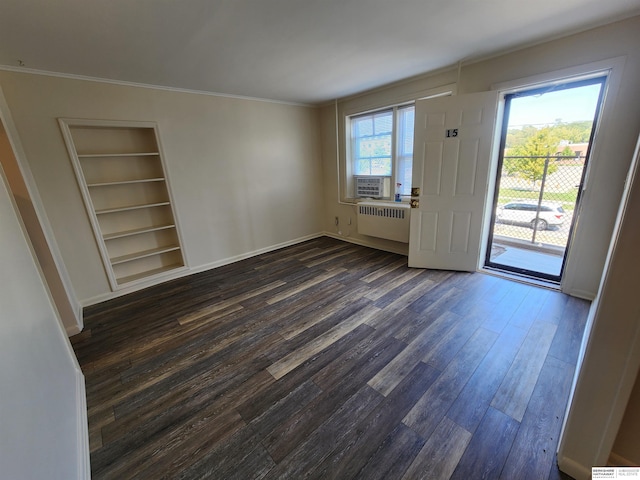 unfurnished room with ornamental molding, dark wood-type flooring, and radiator heating unit