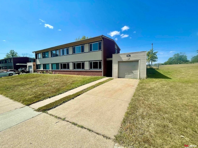 view of front facade featuring a garage and a front yard