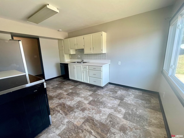 kitchen featuring black dishwasher, range with electric stovetop, sink, white cabinetry, and white refrigerator