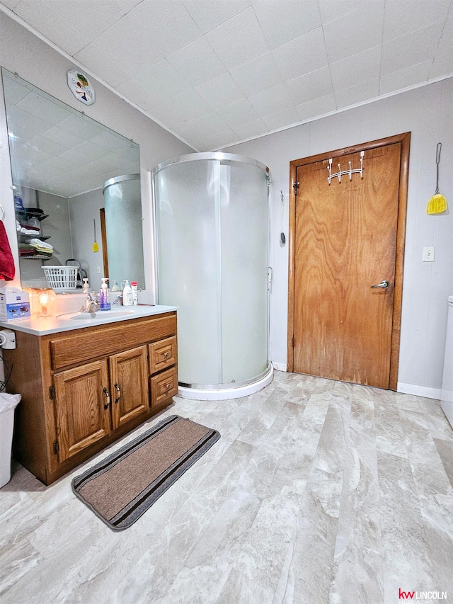 bathroom with vanity and a shower with shower door