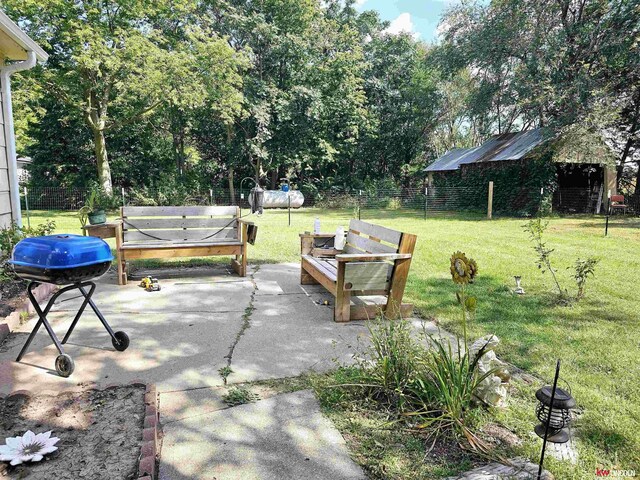 view of patio / terrace featuring area for grilling and fence