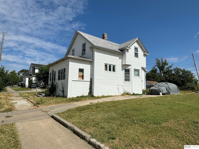 view of home's exterior featuring a yard