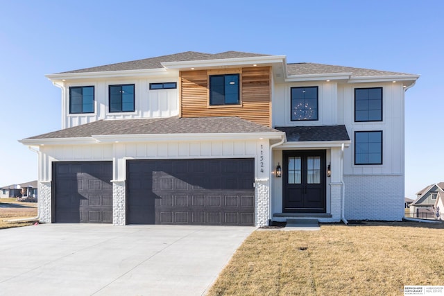 view of front facade with a front lawn and a garage