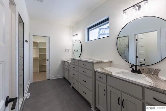 bathroom featuring tile patterned flooring and vanity