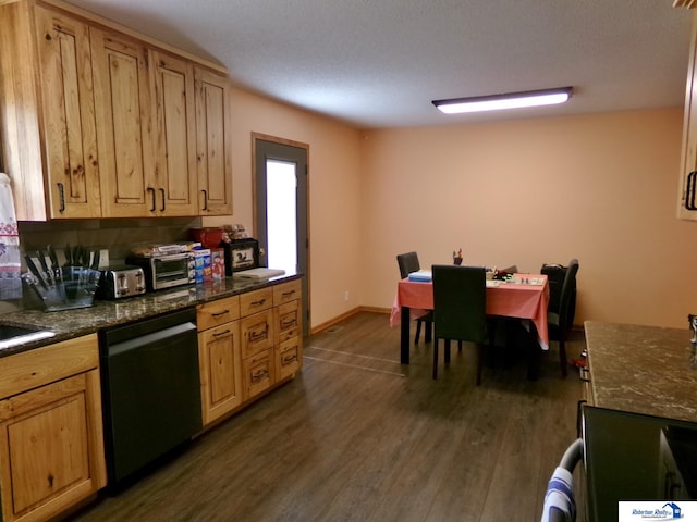 kitchen featuring light brown cabinets, stove, stainless steel dishwasher, a textured ceiling, and dark wood-type flooring