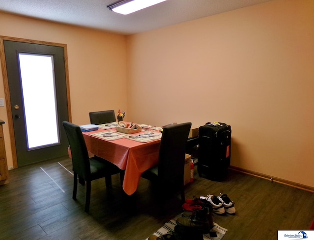 dining space featuring dark hardwood / wood-style flooring