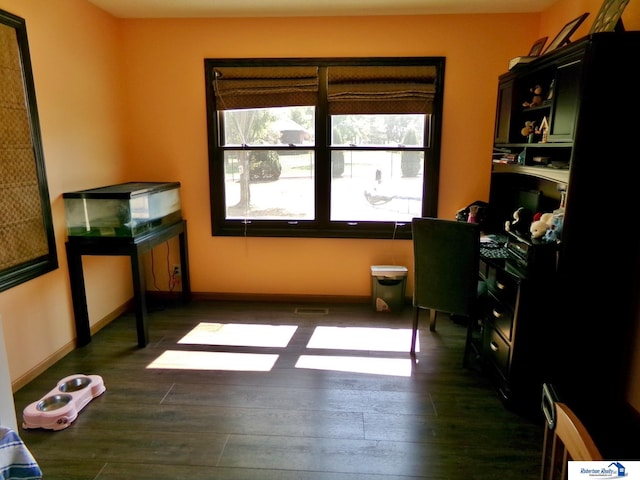 office space with dark wood-type flooring