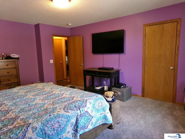 carpeted bedroom with a textured ceiling