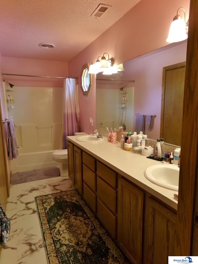 full bathroom with shower / tub combo with curtain, a textured ceiling, vanity, and toilet