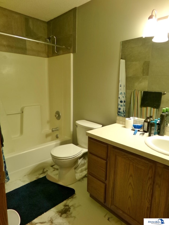 full bathroom with vanity, shower / bath combo with shower curtain, toilet, and a textured ceiling