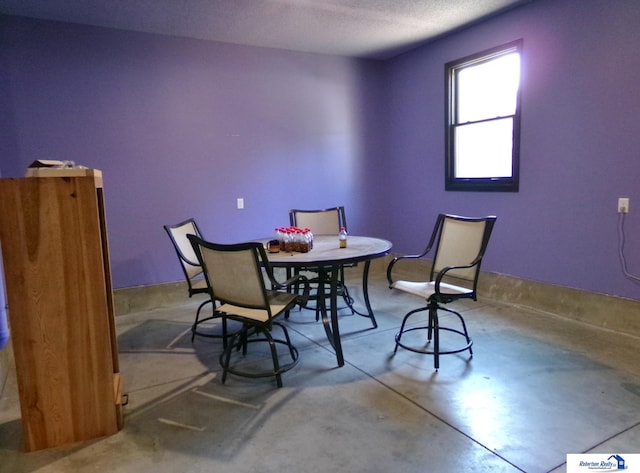 dining room featuring concrete floors