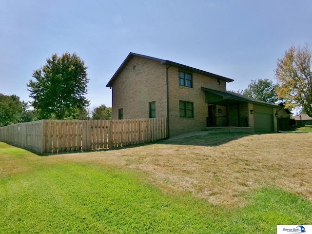 rear view of property with a lawn