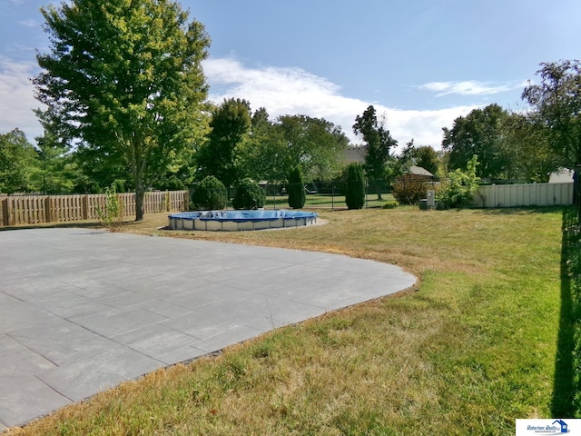 view of patio / terrace with a covered pool