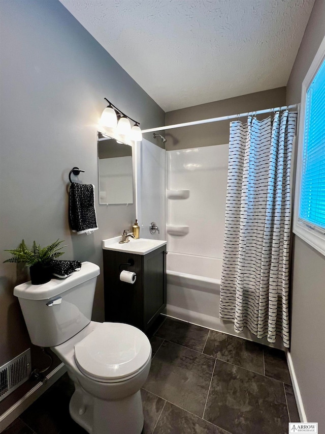 full bathroom with shower / bath combo, a textured ceiling, tile patterned floors, vanity, and toilet