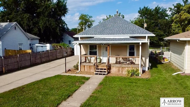 exterior space featuring a porch and a front yard