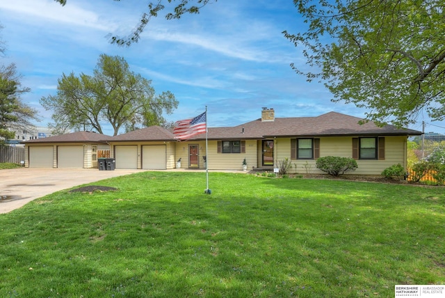 single story home with a front yard and a garage