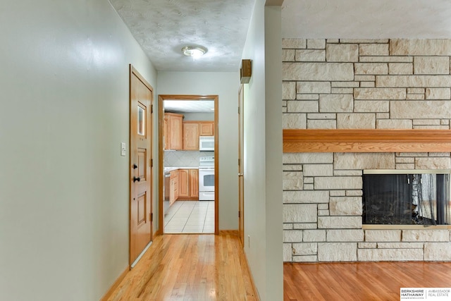 hall with light wood-type flooring