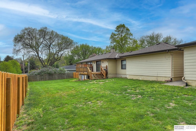 view of yard with a deck