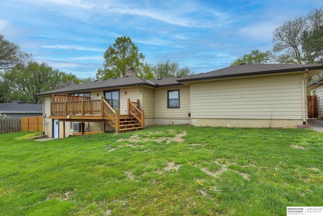 back of property with a yard, a deck, and central air condition unit