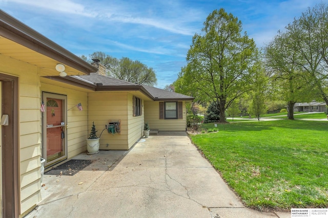 view of side of property featuring a yard