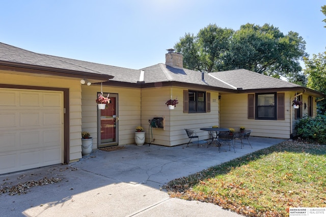 ranch-style home with a garage