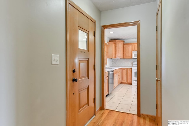 corridor featuring light hardwood / wood-style flooring