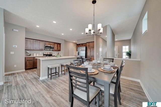 8501 Regent Ct, Lincoln, NE 68507 - dining space featuring light wood-type flooring and a chandelier