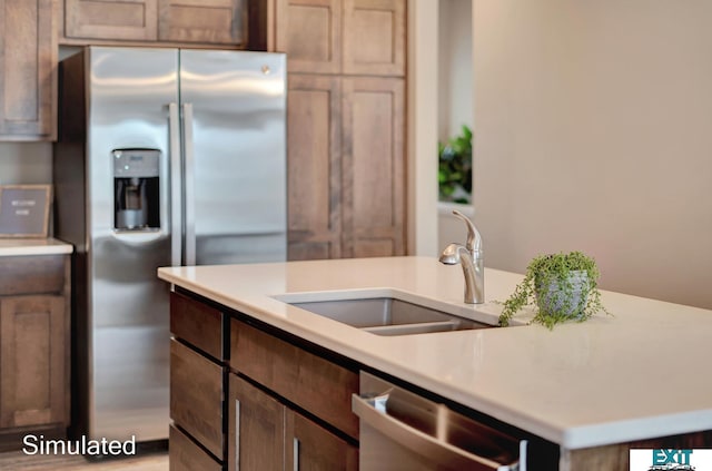 8501 Regent Ct, Lincoln, NE 68507 - kitchen featuring a kitchen island with sink, appliances with stainless steel finishes, and sink