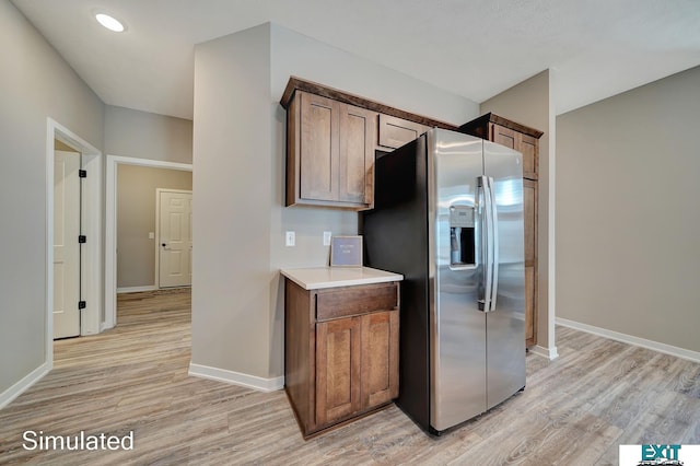 8501 Regent Ct, Lincoln, NE 68507 - kitchen with stainless steel fridge and light hardwood / wood-style flooring