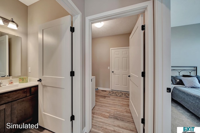 8501 Regent Ct, Lincoln, NE 68507 - bathroom with vanity and hardwood / wood-style floors