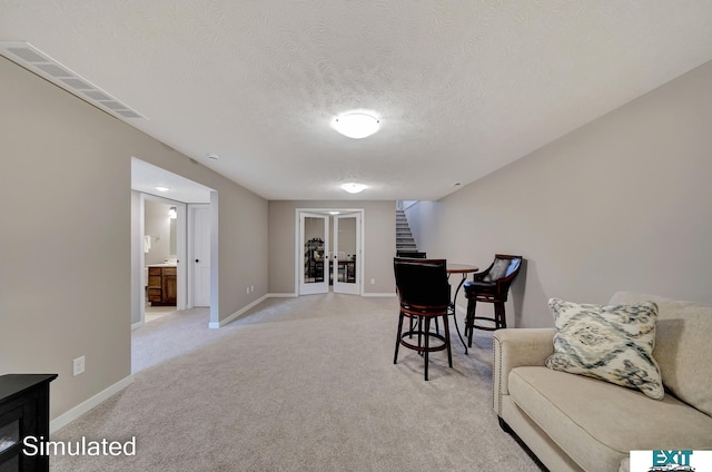 8501 Regent Ct, Lincoln, NE 68507 - interior space featuring light carpet and a textured ceiling