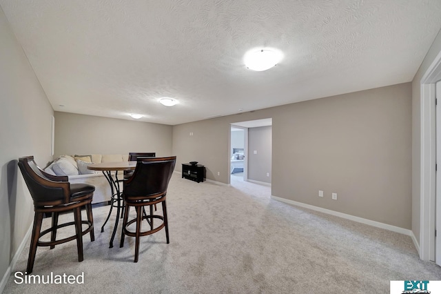8501 Regent Ct, Lincoln, NE 68507 - carpeted dining space featuring a textured ceiling