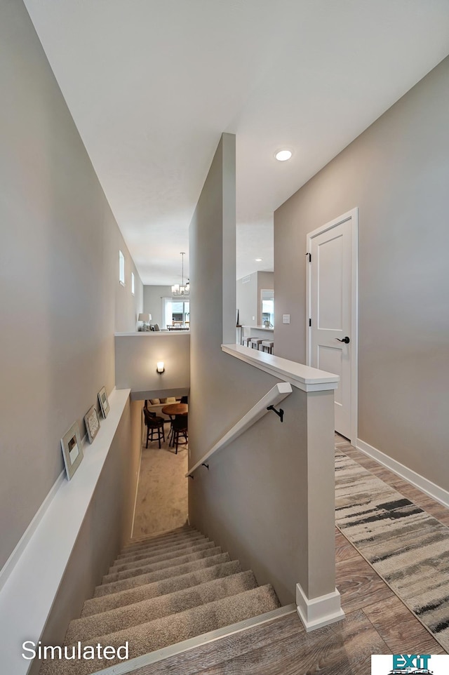 8501 Regent Ct, Lincoln, NE 68507 - stairs with hardwood / wood-style floors and a notable chandelier