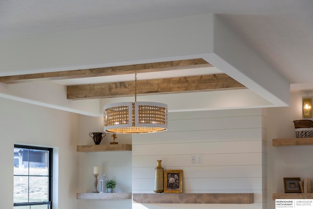 room details with beam ceiling and an inviting chandelier