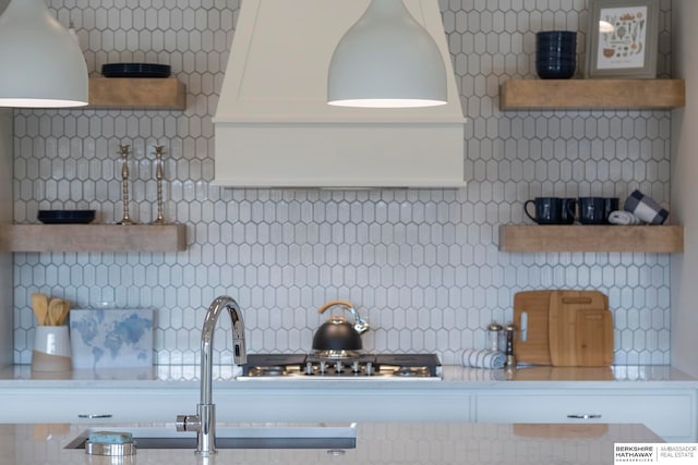 kitchen with sink and tasteful backsplash