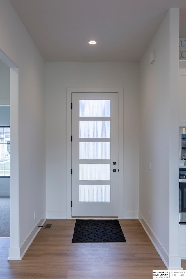 doorway to outside featuring light wood-type flooring