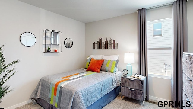 bedroom with light colored carpet